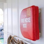 red fire hose box on focus photo
